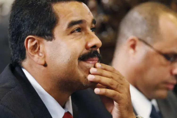 
	O candidato chavista, Nicol&aacute;s Maduro, venceu o l&iacute;der da oposi&ccedil;&atilde;o pela curta margem de 1,8%, o que representa 272 mil votos de diferen&ccedil;a
 (REUTERS/Enrique Castro-Mendivi)