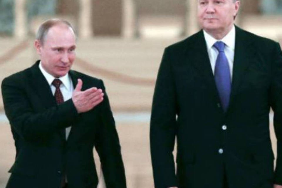 
	Viktor Yanukovich e Vladmir Putin: desde domingo, mais de 1.700 pessoas ficaram feridas em Kiev nos confrontos entre manifestantes e a pol&iacute;cia, segundo a oposi&ccedil;&atilde;o
 (AFP)