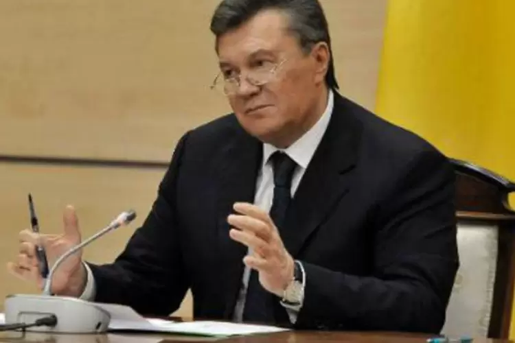 O presidente ucraniano destituído Viktor Yanukovich: nota vermelha é uma ordem de captura com fins de extradição (Andrey Kronberg/AFP)