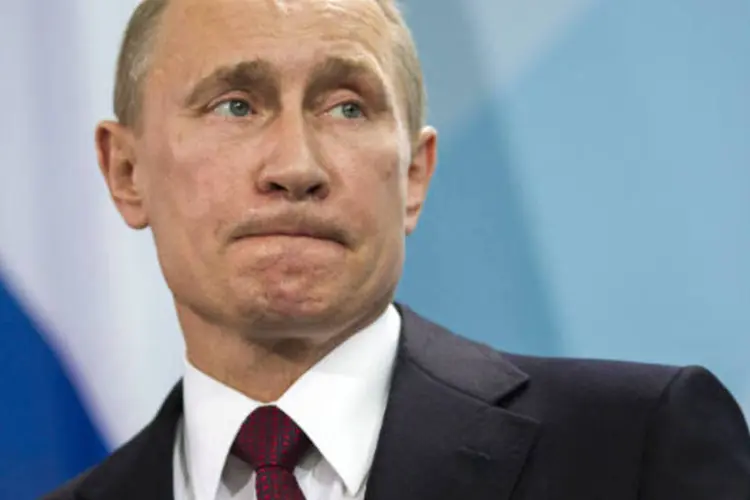 
	Vladimir Putin: enquanto o crescimento russo vacila e o rublo desaba, os capitais continuam saindo do pa&iacute;s
 (Carsten Koall/Getty Images)