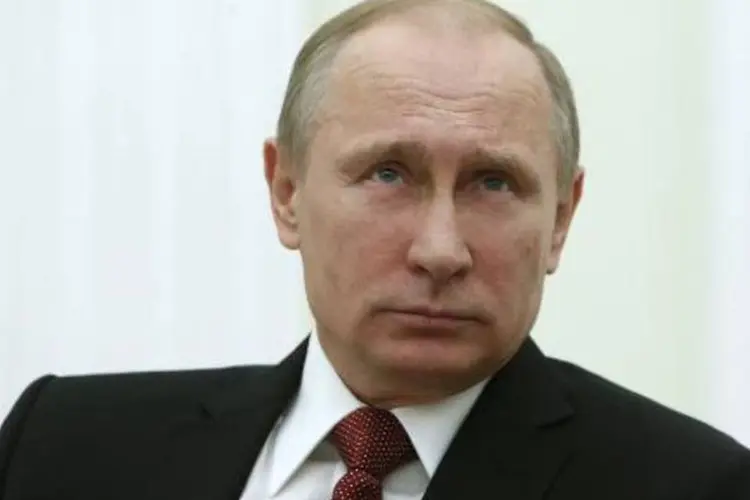 Putin sobre anexação da Crimeia: "terminamos às sete da manhã e no final disse a todos que deveríamos trabalhar para o regresso da Crimeia à Rússia" (Sergei Karpukhin/AFP)
