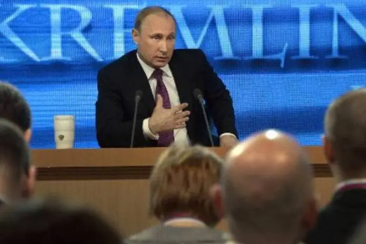 Vladimir Putin em coletiva de imprensa em Moscou:"na pior das hipóteses, a crise vai durar dois anos, mas pode melhorar antes e, de todos os modos, terá uma solução de forma inevitável" (Alexander Nemenov/AFP)