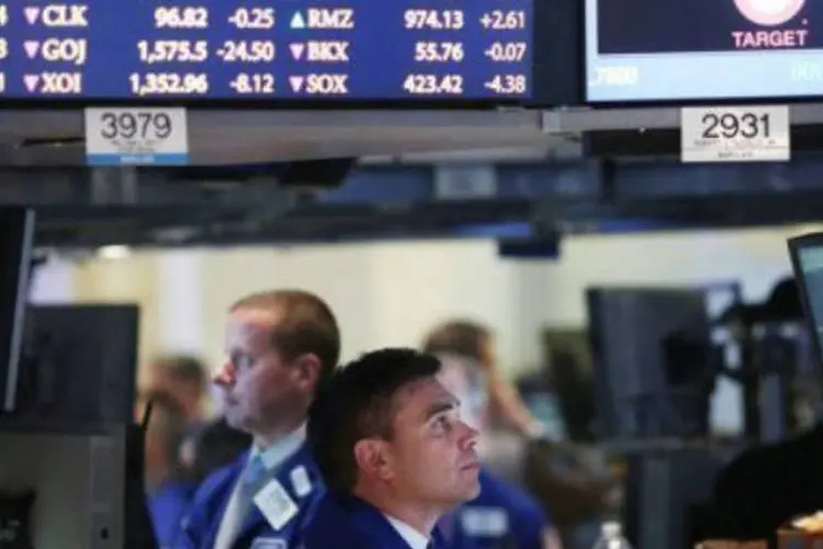 Wall Street: o índice Dow Jones subiu 0,38 %, a 14.606 pontos. O S&P 500 ganhou 0,4 %, a 1.559 pontos. O Nasdaq cresceu 0,2 %, a 3.224 pontos. (Getty Images/AFP/File)
