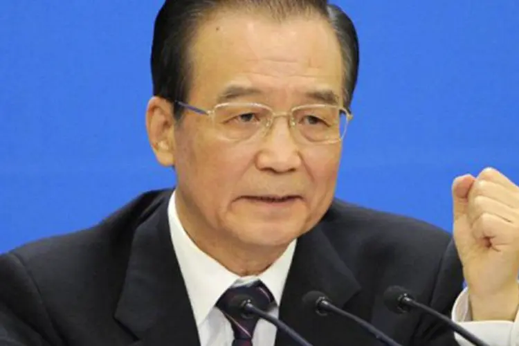
	Wen: a China&nbsp;&quot;ainda enfrenta dificuldades consider&aacute;veis no &uacute;ltimo trimestre&quot;, admitiu o primeiro-ministro
 (Liu Jin/AFP)