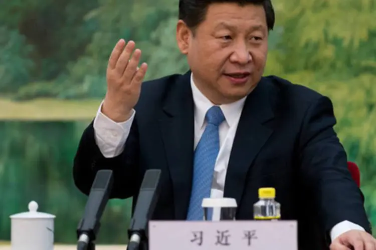 
	Xi Jinping participa de encontro com especialistas estrangeiros em Pequim: uma hist&oacute;ria pessoal tamb&eacute;m liga Xi Jinping a Shenzhen
 (Ed Jones/AFP)