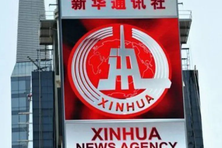 A Xinhua tem 11.000 funcionários atualmente
 (Stan Honda/AFP)
