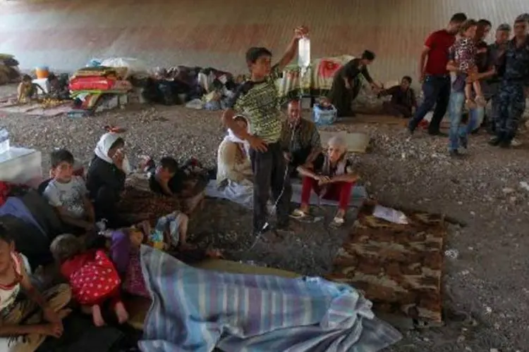 
	Yazidis se refugiam em abrigo na cidade curda de Dohuk: EUA enviam mais 130 militares
 (Ahmad al-Rubaye/AFP)