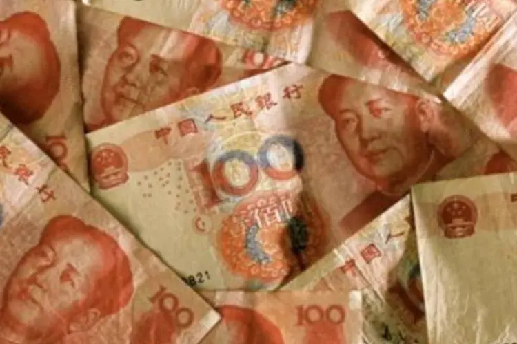 Notas de iuane: dívida externa da China acelerou a alta na comparação com o segundo trimestre (Getty Images)