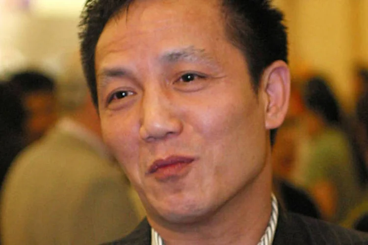 Zhou Zhengyi: 11º mais rico em 2002 e condenado a três anos de prisão em 2003 por fraude financeira e a 16 anos em 2008 por fraude e propina (China Photos/Getty Images)