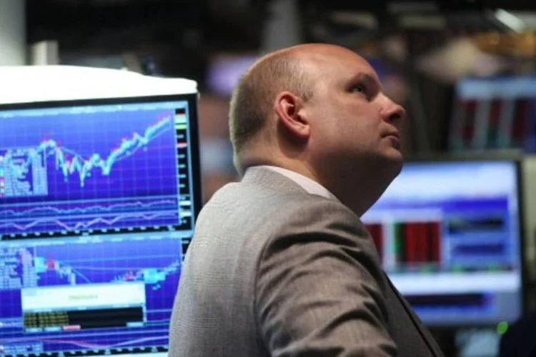 
	Dow Jones: o &iacute;ndice Dow Jones terminou em baixa de 0,07%, aos 18.268,50 pontos
 (Spencer Platt/Getty Images)
