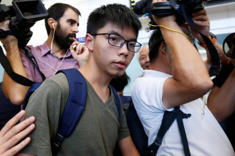 
	Joshua Wong: Wong tinha sido convidado para dar uma confer&ecirc;ncia sobre seu ativismo a favor da democracia
 (Bobby Yip / Reuters)