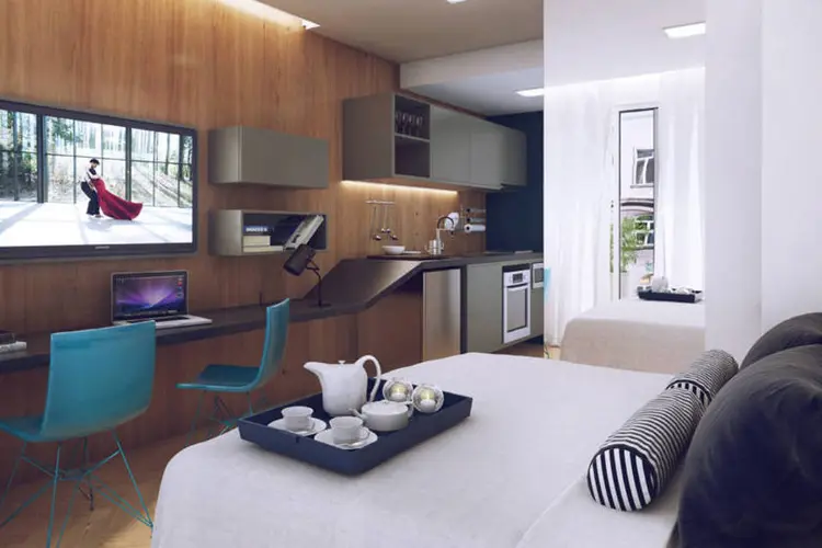 
	Decorado de apartamento com 18 metros quadrados: Sof&aacute; vira cama na sala-cozinha
 (Divulgação/Assessoria de imprensa da Setin)