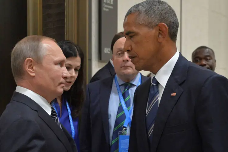 
	Obama e Putin: &quot;&Eacute; muito dif&iacute;cil dialogar com o atual governo americano. Praticamente, n&atilde;o h&aacute; di&aacute;logo&quot;, disse o russo
 (Alexei Druzhinin / Reuters)