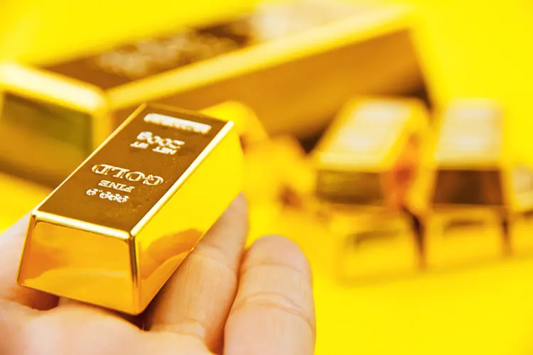 Ouro é negociado abaixo de US$ 1.557,11, o nível mais alto em seis anos atingido no mês passado. (ponsulak/Thinkstock)