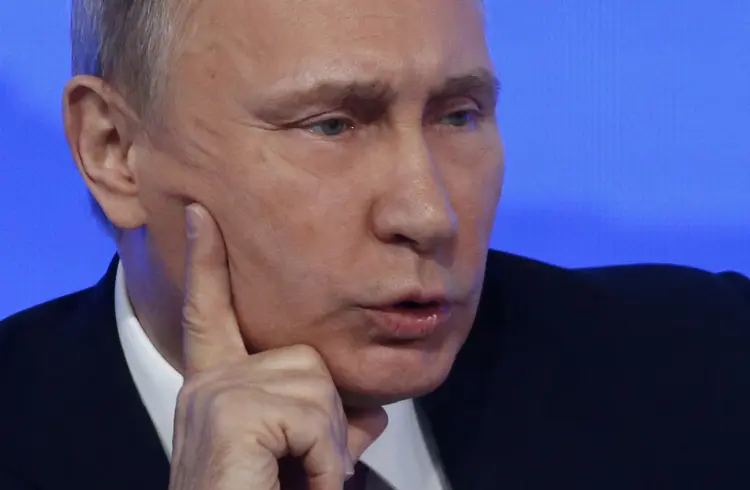 Vladimir Putin: "estão planejando plantar algum tipo de substância e acusar as autoridades sírias de usar (armas químicas)." (Sergei Karpukhin/Reuters)