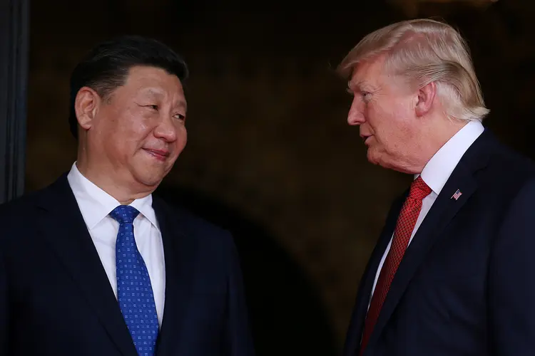 Xi e Trump: elogios sucedem uma série de medidas protecionistas entre China e EUA (Carlos Barria/Reuters)