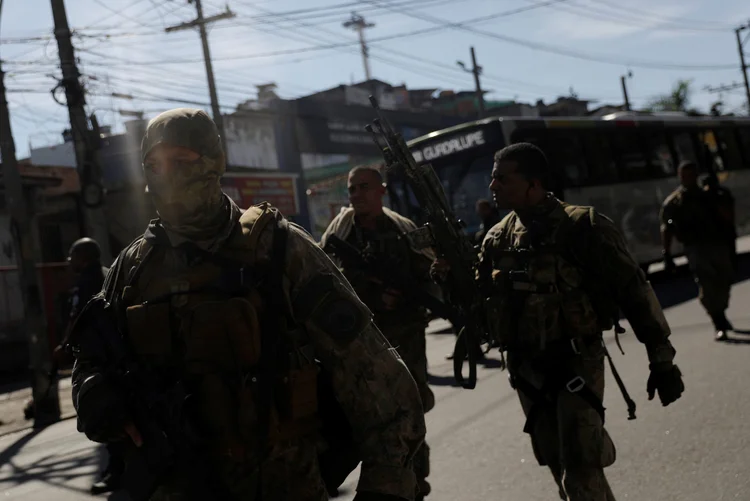 Policemen of Special Operations Battalion (BOPE) are pictured during a protest against violence in Alemao slums complex after the death of Paulo Henrique de Oliveira, 13, during a shootout between drug dealers and police in Rio de Janeiro, Brazil, April 25, 2017.  (REUTERS/Ricardo Moraes/Reuters)