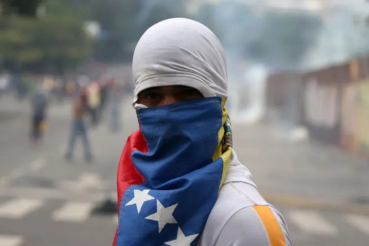 Crise na Venezuela: o país governado por Maduro vem enfrentando diversos protestos contra o líder político (Carlos Garcia Rawlins/Reuters)