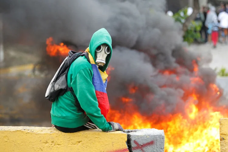 Protestos na Venezuela: "Desde o dia 6 de abril, 29 compatriotas foram assassinados por culpa da direita", disse Maduro (Christian Veron/Reuters)