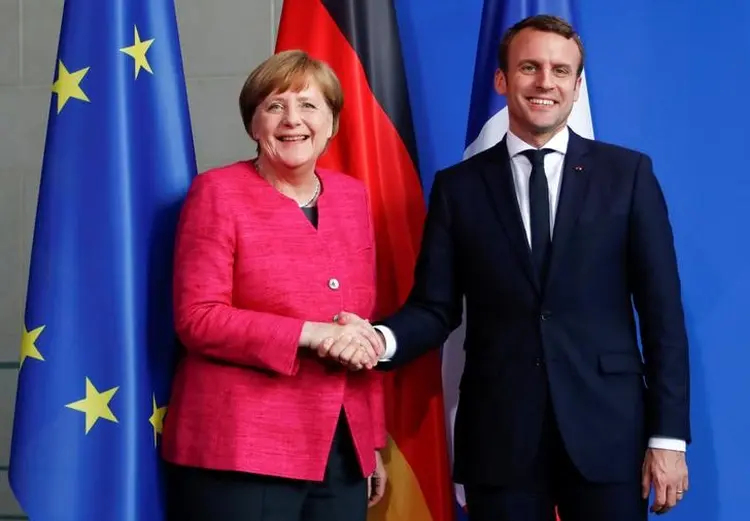 Merkel e Macron: a chanceler diz que a reforma "é importante e produzirá bons resultados" (Fabrizio Bensch/Reuters)