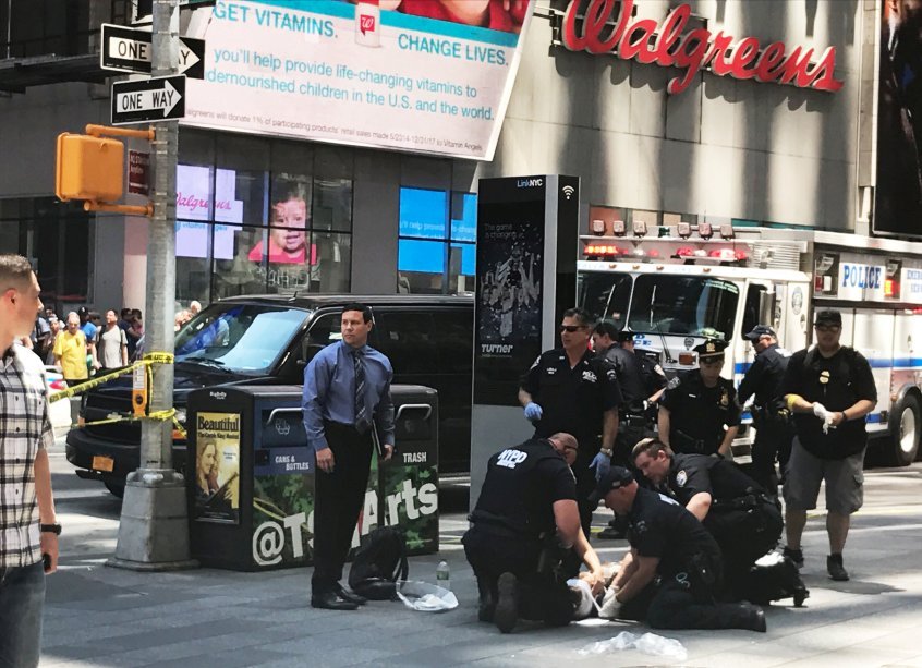 First responders are assisting injured pedestrians after a vehicle struck pedestrians on a sidewalk in Times Square in New York, U.S., May 18, 2017.  REUTERS/Jeremy Schultz