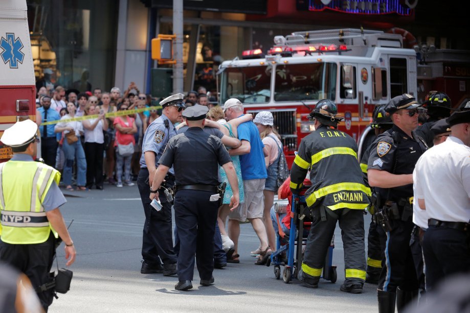 First responders tend to injured pedestrians after a vehicle struck pedestrians on a sidewalk in Times Square in New York, U.S., May 18, 2017.  REUTERS/Lucas Jackson