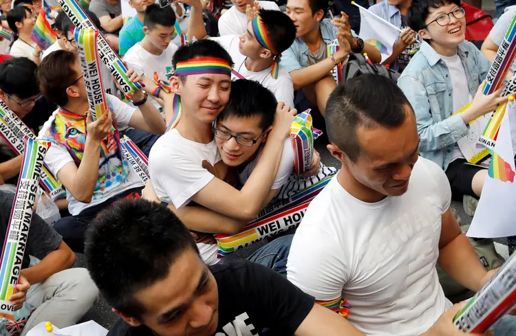 Supporters hug each other during a rally after Taiwan's constitutional court ruled that same-sex couples have the right to legally marry, the first such ruling in Asia, in Taipei, Taiwan May 24, 2017. REUTERS/Tyrone Siu     TPX IMAGES OF THE DAY (Tyrone Siu/Reuters)