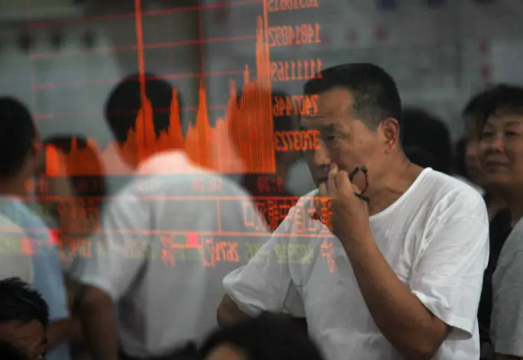 China: principal índice acionário chinês, o Xangai Composto subiu 0,88% hoje, a 3.054,25 pontos (China Photos/Getty Images)