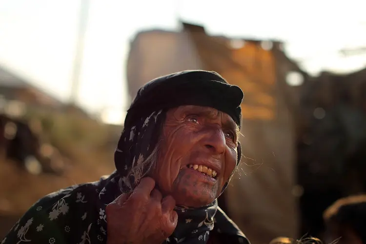 REFUGIADA DE ALEPO: Mulher síria recebe acolhimento na cidade de Majdal Anjar, no Líbano. / Spencer Platt/Getty Images