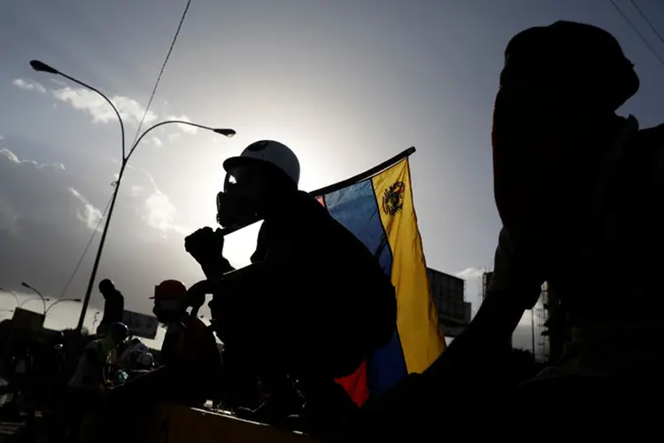 Venezuela: os confrontos entre manifestantes e as forças da ordem já mataram 75 pessoas (Carlos Garcia Rawlins/Reuters)