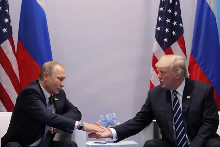 Putin e Trump: Não cabe a mim avaliar o trabalho do presidente. Isso precisa ser feito pelos eleitores, o povo americano" (Carlos Barria/Reuters)