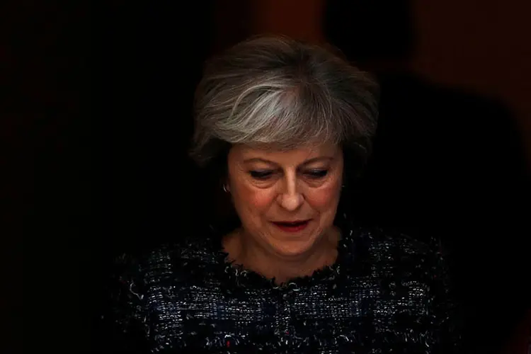 Theresa May: A líder conservadora indicou que se esgotaram "todos os canais diplomáticos possíveis" antes de concordar com EUA e França (Peter Nicholls/Reuters)