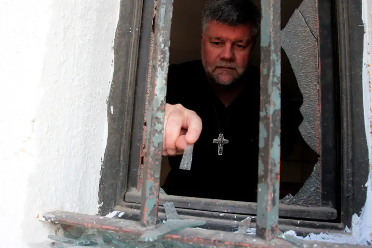 Ataques no Chile: em três ações as igrejas sofreram danos, principalmente em portas e fachadas (Christian Iglesias/Reuters)