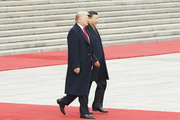 Trump e Xi Jinping: O governo chinês afirmou que o aumento por parte dos americanos viola as regras da OMC (Pool/Getty Images)