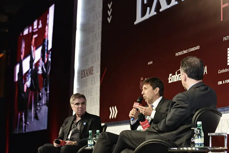 FLÁVIO ROCHA E JOÃO AMOÊDO EM EVENTO DA EXAME: com a saída do empresário, o representante do partido Novo é o último dos outsiders (Germano Lüders/Exame)