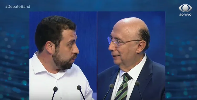 Guilherme Boulos e Henrique Meirelles no primeiro debate da Band (Exame/Divulgação)