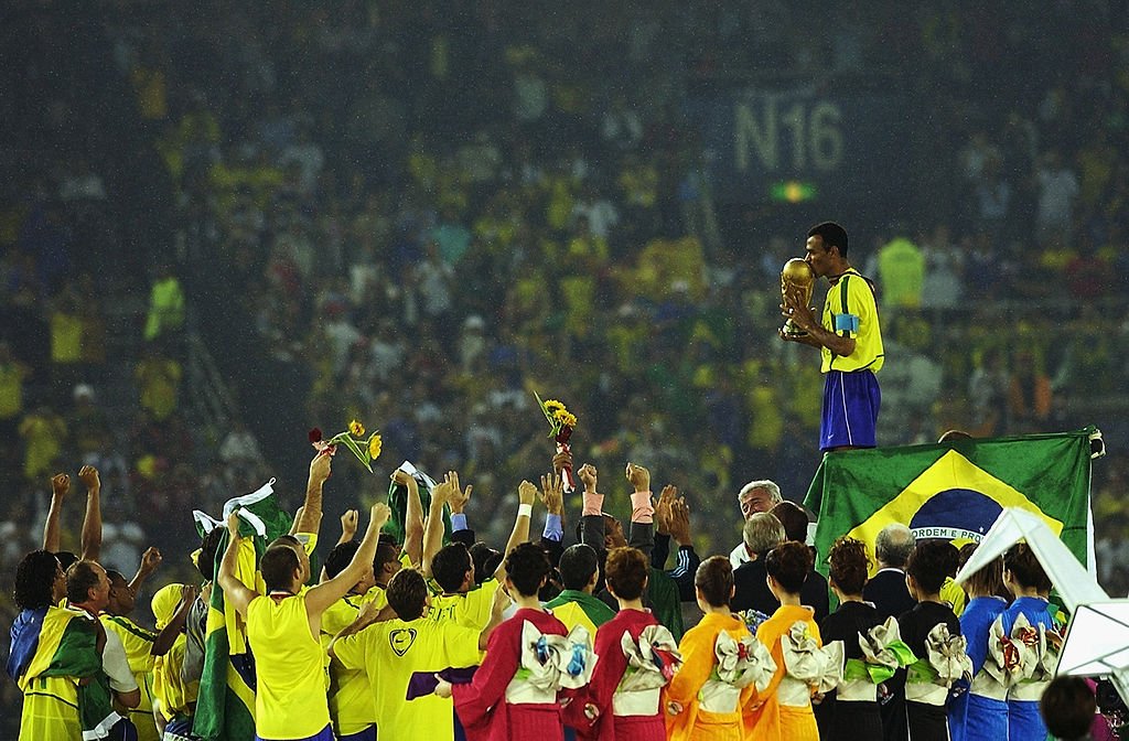 YOKOHAMA - JUNE 30:  Cafu on the podium celebrates with the World Cup trophy after the World Cup Final match against Germany played at the International Stadium Yokohama, Yokohama, Japan on June 30, 2002.  Brazil won the match 2-0. (Photo by Shaun Botterill/Getty Images) (Shaun Botterill/Getty Images)