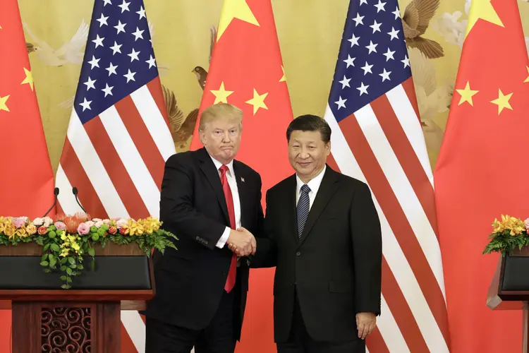 Trump e Xi Jinping: presidentes irão se encontrar durante reunião do G20 em Buenos Aires e podem amenizar a crescente tensão entre os dois países (Qilai Shen/Getty Images)