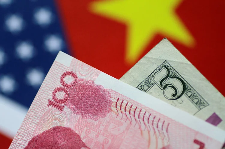 Yuan e dólar: BC da China fixa yuan no menor nível desde a crise de 2008 (Thomas White/Reuters)