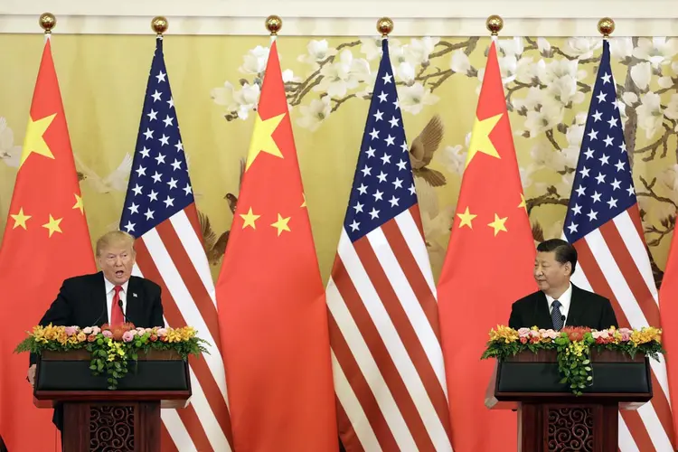 Donald Trump e Xi Jinping: governos dos EUA e da China organizam diálogo para acabar com a guerra comercial (Qilai Shen/Bloomberg/Getty Images)