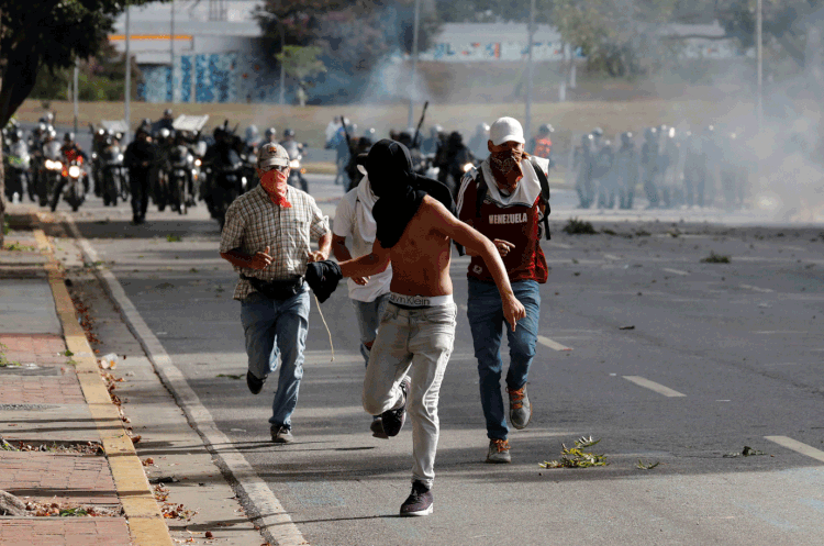 Venezuela: Protestos deixa mortos e feridos pelo país (Carlos Garcia Rawlins/Reuters)