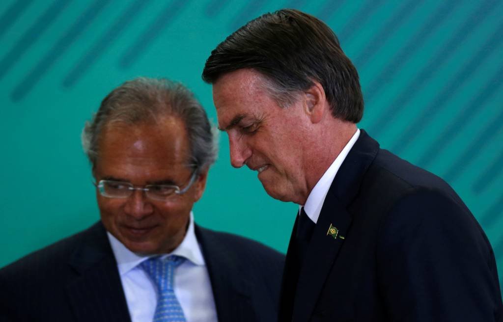Paulo Guedes, ministro da Economia ao lado do presidente Jair Bolsonaro: Proposta de reforma da Previdência foi entregue ao Congresso no início desta semana (Adriano Machado/Reuters)