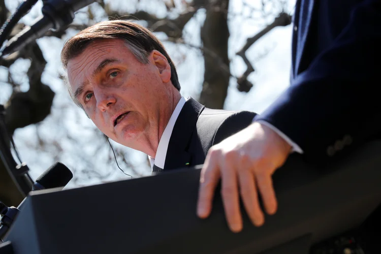 Jair Bolsonaro: briga entre guru do governo e líder evangélico é a nova dor de cabeça para o presidente (Carlos Barria/Reuters)
