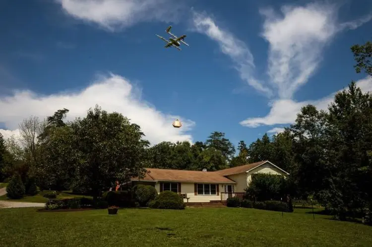 A Google X Project Wing drone delivers a package at a home during a demonstration in Blacksburg, Virginia. Photographer:  (Charles Mostoller/Bloomberg/Bloomberg)