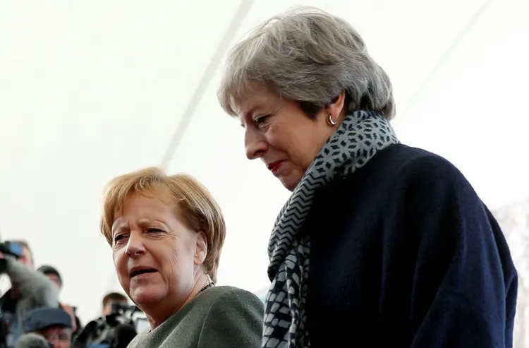 Theresa May: primeira-ministra ontem com Merkel e Macron para discutir o Brexit (Fabrizio Bensch/Reuters)