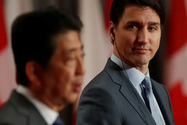 Justin Trudeau e Shinzo Abe: primeiros-ministros estimam que este pode servir de modelo para futuros acordos comerciais (AFP/AFP Photo)