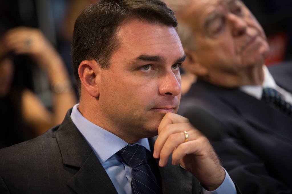 Senator Flavio Bolsonaro, a Social Liberal Party (PSL) member for Rio de Janeiro state, listens during a confirmation hearing for Roberto Campos Neto, president of the Central Bank of Brazil nominee for Brazilian President Jair Bolsonaro, not pictured, in Brasilia, Brazil, on Tuesday, Feb. 26, 2019. Campos Neto in his initial remarks ticked off several boxes on the investor wish list, such as reaffirming the need for fiscal discipline, inflation control, and central bank autonomy. Photographer: Andre Coelho/Bloomberg (Andre Coelho/Bloomberg)