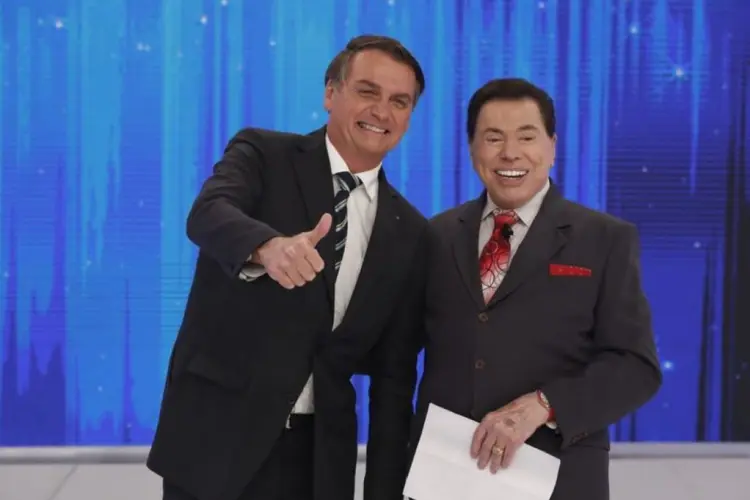 Silvio Santos e Jair Bolsonaro: apresentador insistiu que presidente falasse sobre a reforma da Previdência (Secom/Divulgação)