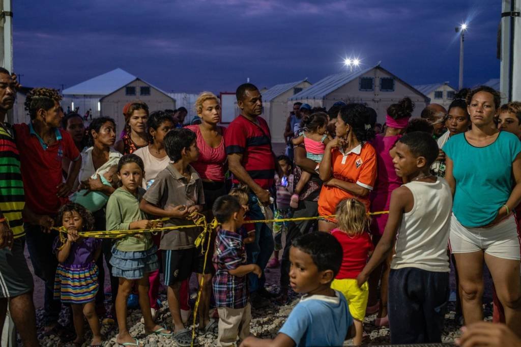 Venezuela: refugiados venezuelanos na fronteira tentam sair do país, que enfrenta grave crise política e econômica (Bloomberg/Federico Rios)