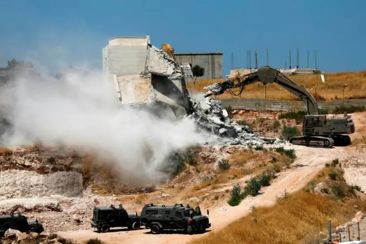 Demolição: em junho, a Suprema Corte israelense determinou a demolição dos edifícios por considerar que eles são perigosos por estarem perto da cerca de separação construída por Israel para delimitar a fronteira (Michael Smith/AFP)